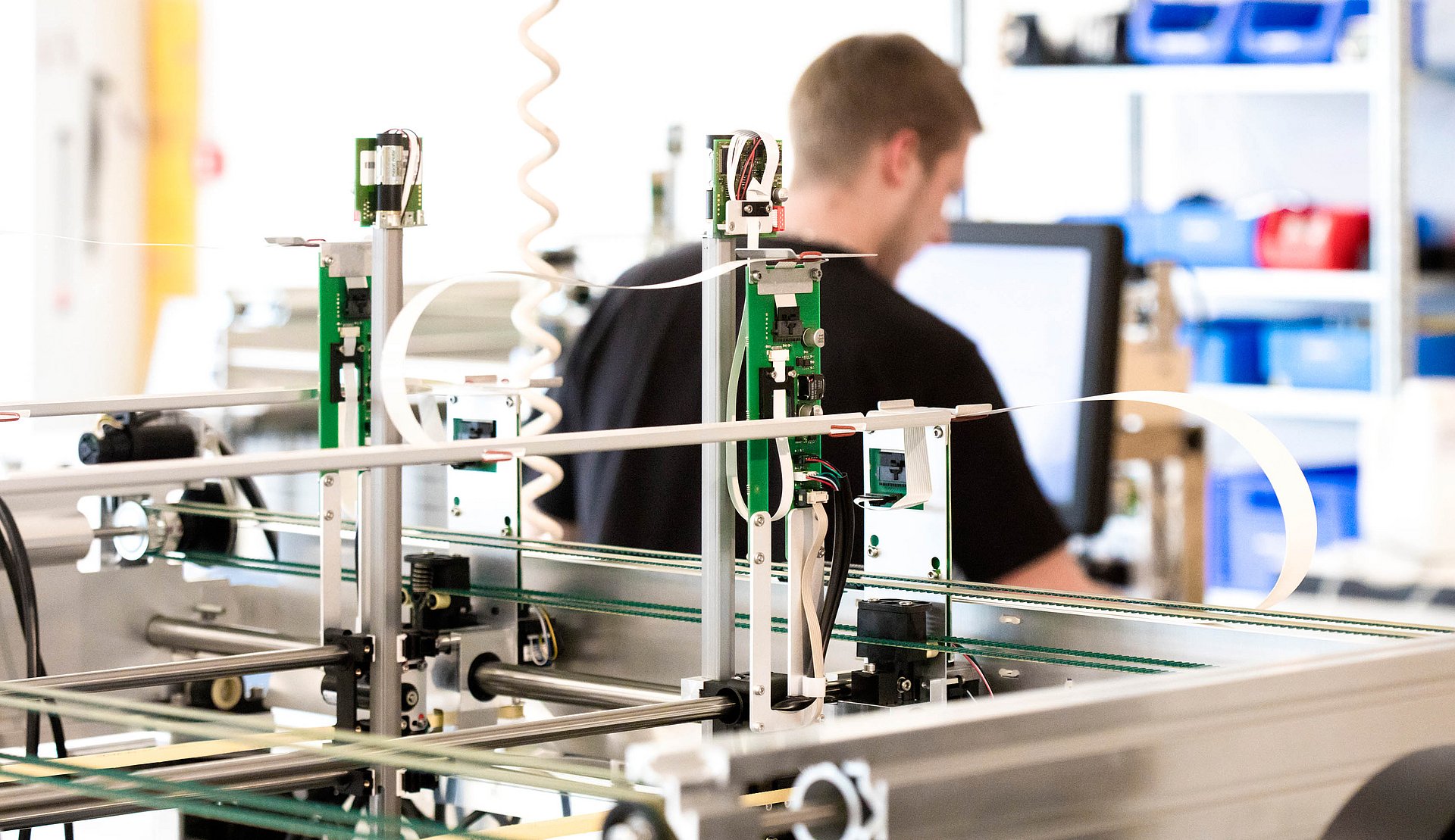 A close-up of our system in the laboratory with a STRATEC employee in the background