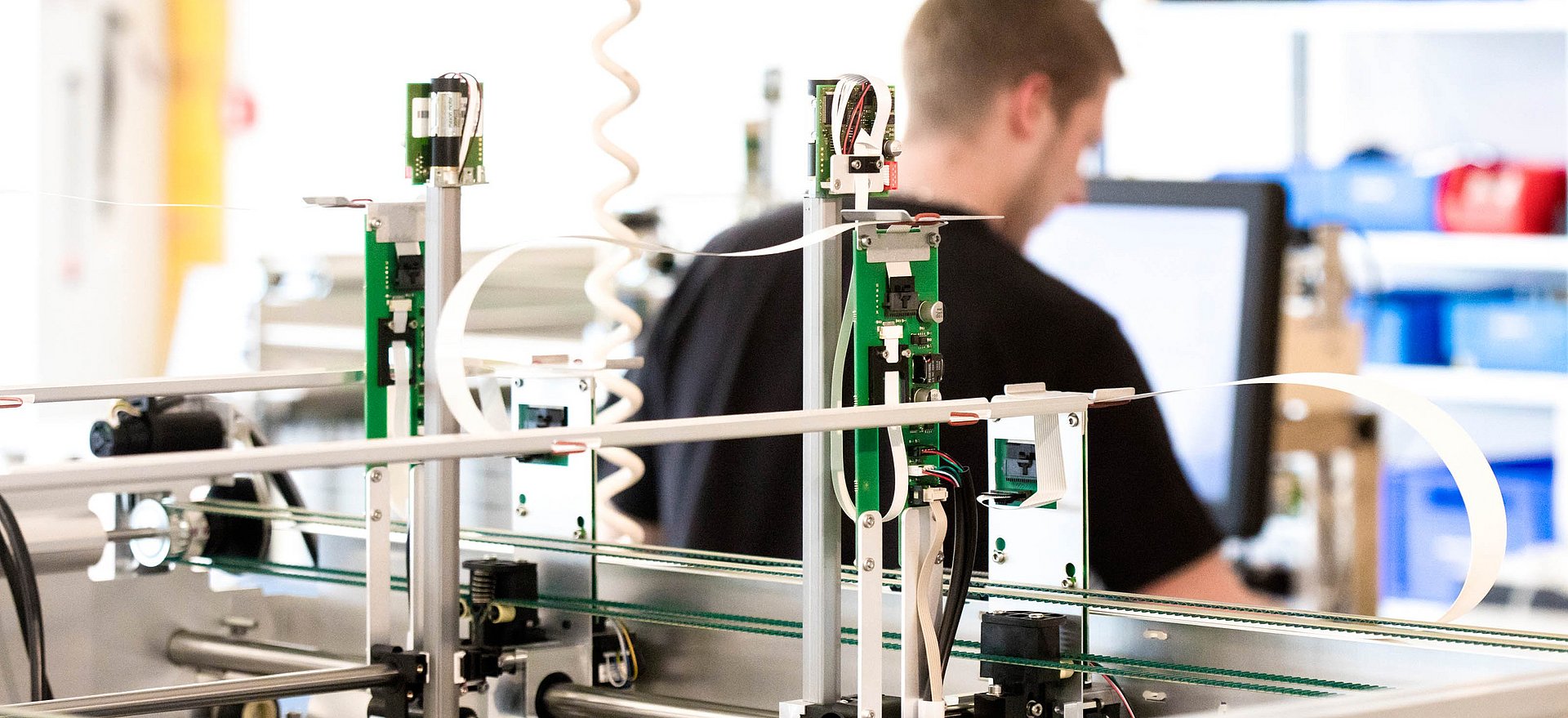 A close-up of our system in the laboratory with a STRATEC employee in the background