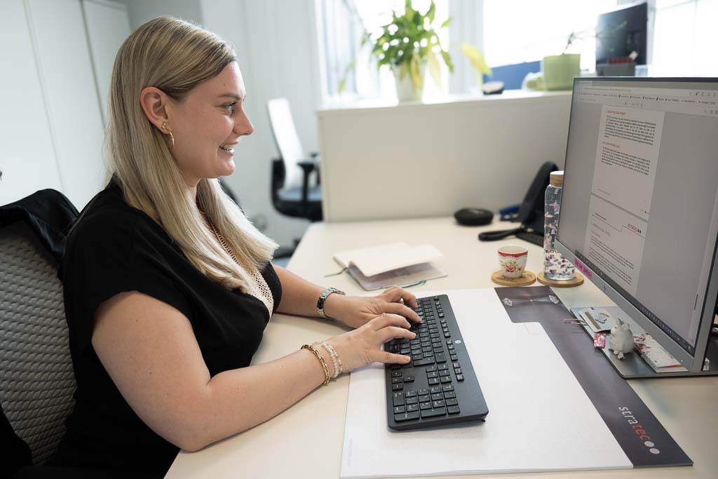 Nicole from STRATEC working on her desk