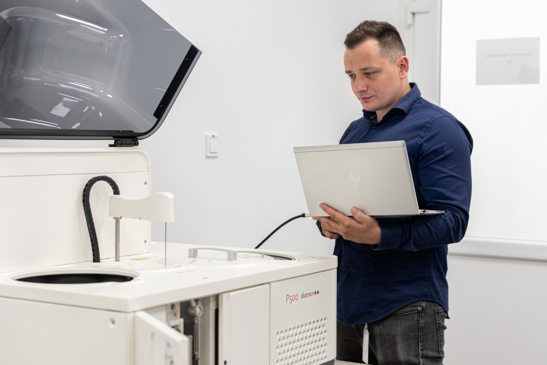 Ádám from Diatron inspecting an instrumentation