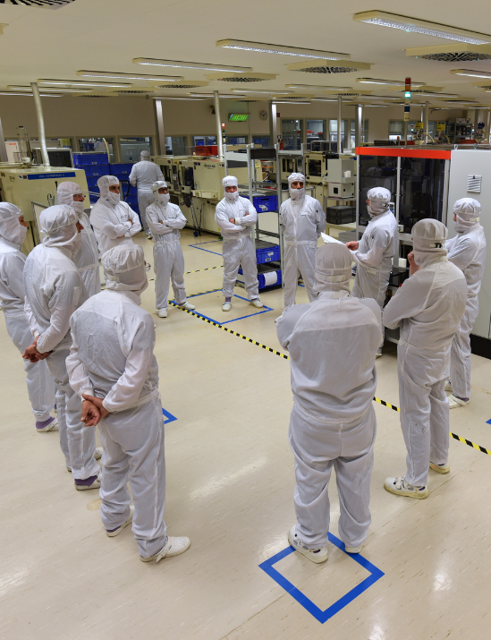 STRATEC workers with safety wears in the manufacturing halls in Anif, Austria