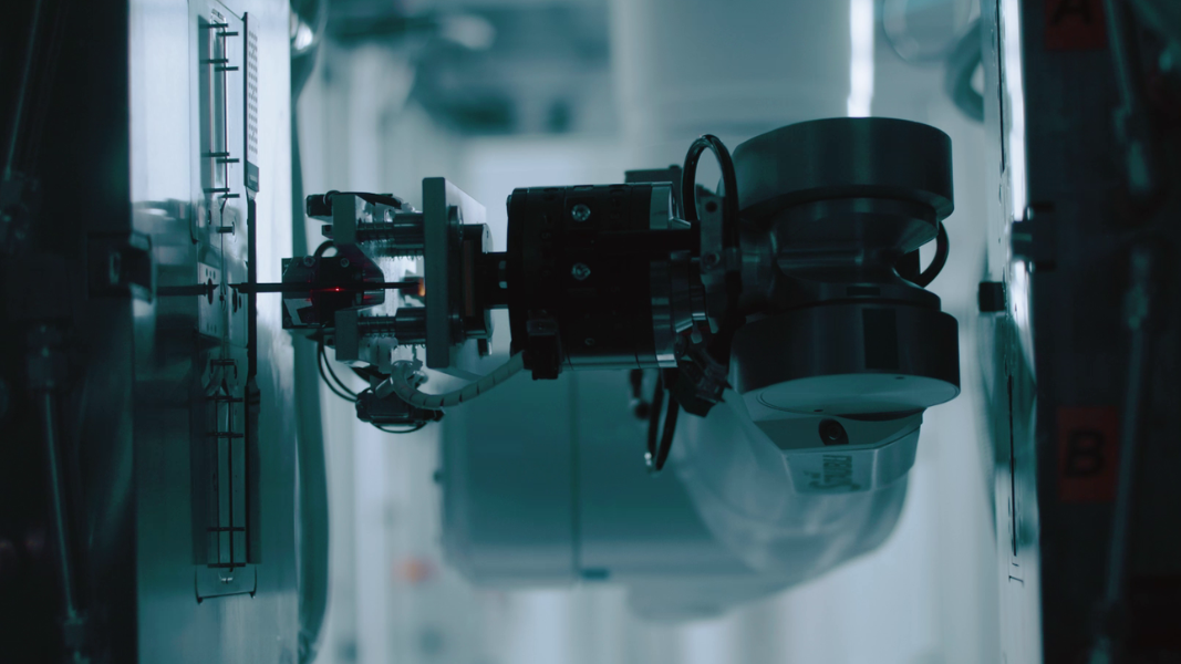 A robotic arm operating in a laboratory setting at STRATEC