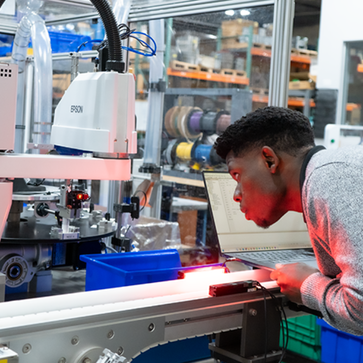 Employee inspecting the functionality of a system from close-up
