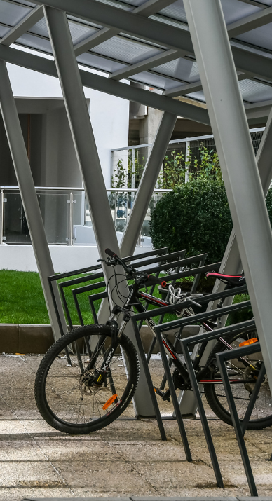 Bicycle parking space at STRATEC Romania with one black bike standing in the bicycle parking