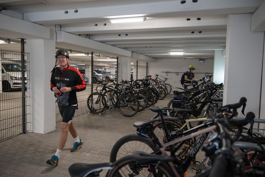 STRATEC employees parking their bikes in the bike parking space in the headquarters in Birkenfeld, Germany